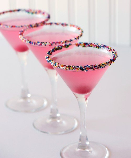 stacey-lane:

Birthday Cake Martini
1.5 ounces vanilla vodka
1.5 ounces cranberry juice
1/2 ounce champagne
Rim glass with Sprinkles (cake frosting helps to make them stick). Combine vodka and cranberry juice in an ice shaker, half-filled with ice cubes. Shake well. Strain into glass. Top with Champagne. Drop in cherry. Enjoy!
photo source: rock-ur-party.tablespoon.com



